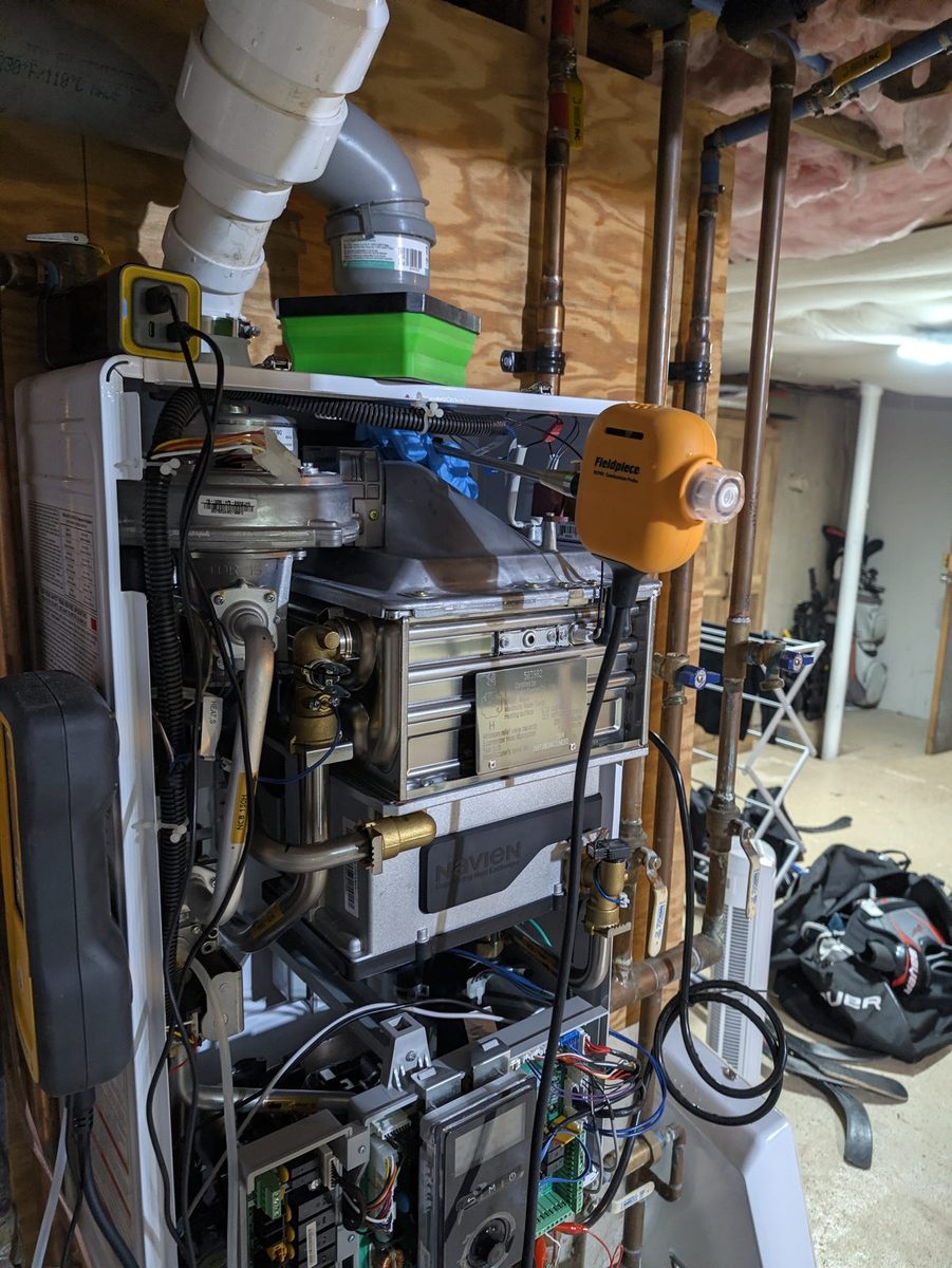 Wall-hung combi boiler open, being tested