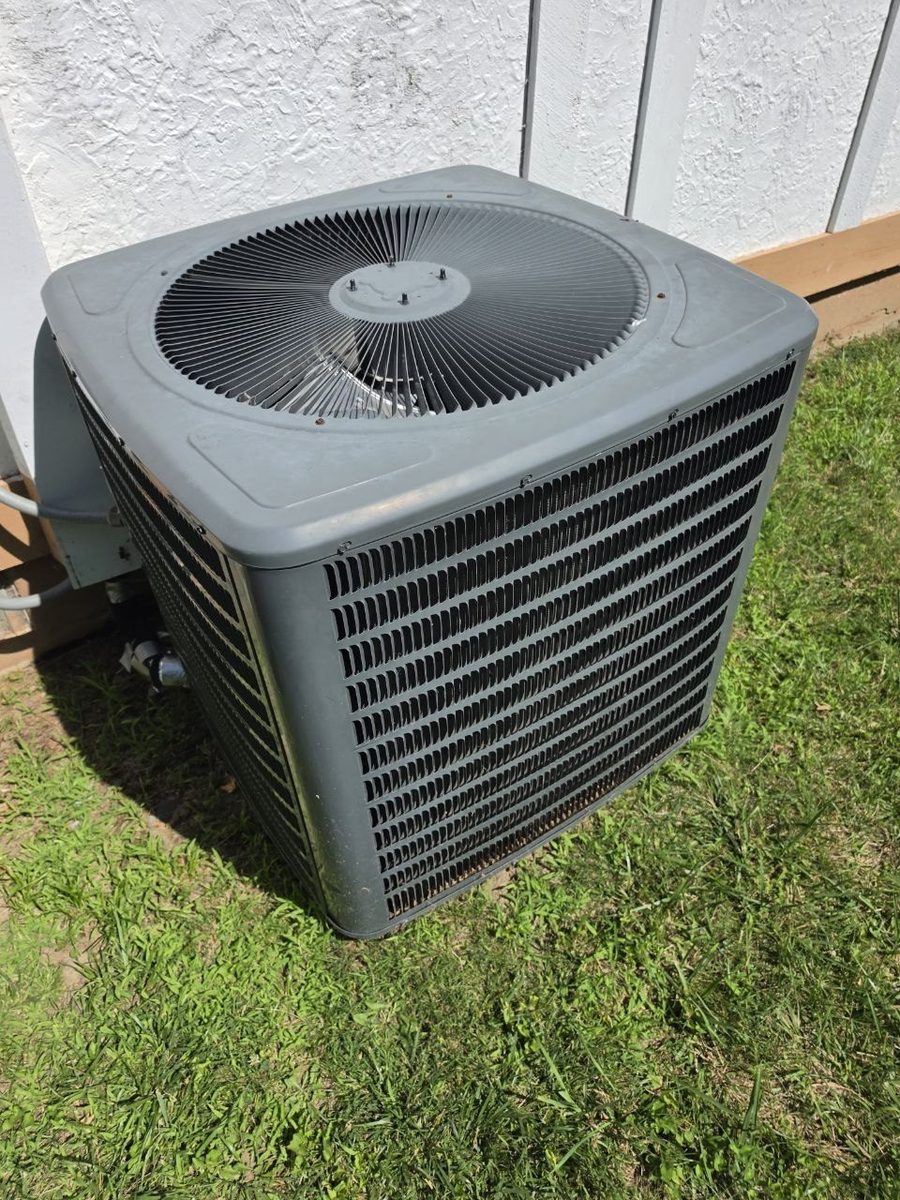 Outdoor AC condenser on a service visit